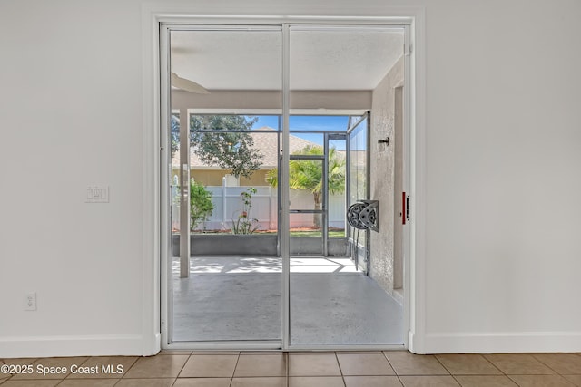 310 Chennault Ln, Rockledge, FL 32955 - entryway with baseboards and light tile patterned flooring
