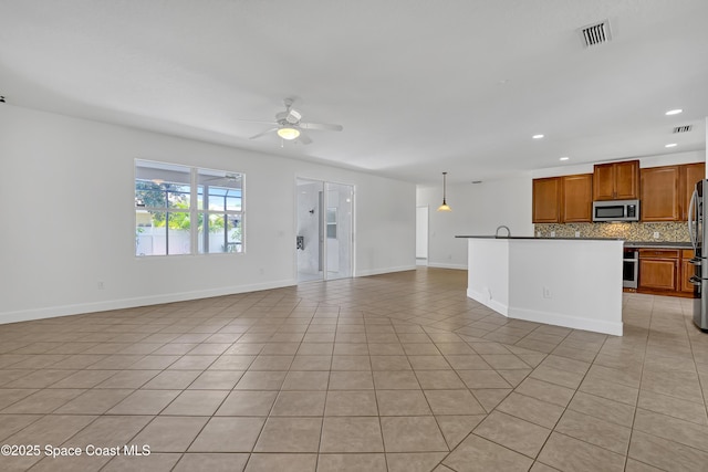 310 Chennault Ln, Rockledge, FL 32955 - unfurnished living room with ceiling fan, recessed lighting, and light tile patterned floors