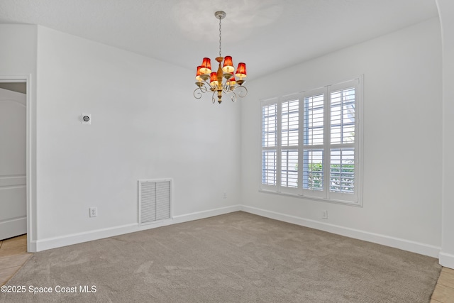 310 Chennault Ln, Rockledge, FL 32955 - carpeted empty room featuring a chandelier and baseboards