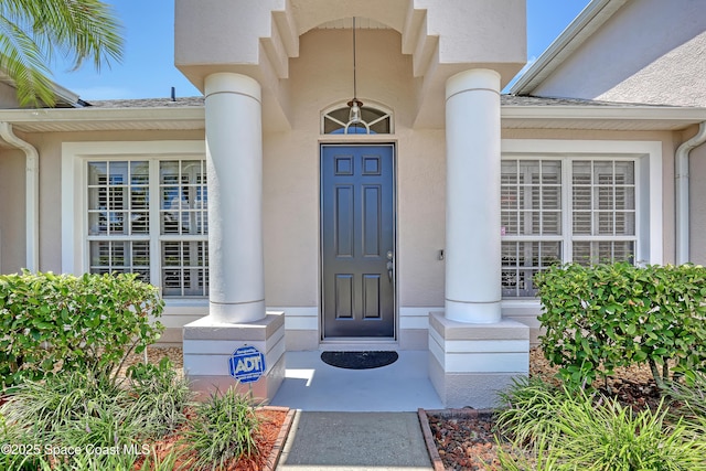 310 Chennault Ln, Rockledge, FL 32955 - doorway to property with stucco siding