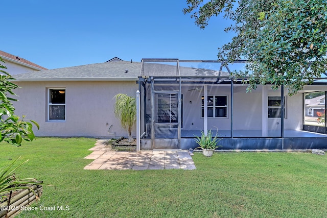 310 Chennault Ln, Rockledge, FL 32955 - back of house with a patio area, stucco siding, and a yard