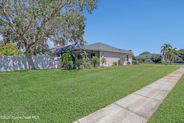 310 Chennault Ln, Rockledge, FL 32955 - view of property exterior with glass enclosure and stucco siding