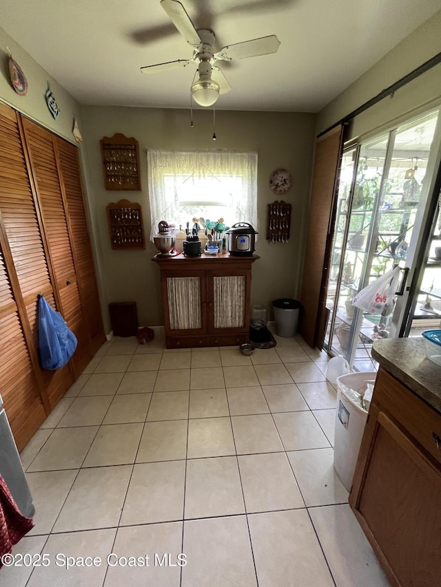 237 Jacaranda Ave NW, Palm Bay, FL 32907 - interior space with healthy amount of natural light, a ceiling fan, and light tile patterned floors