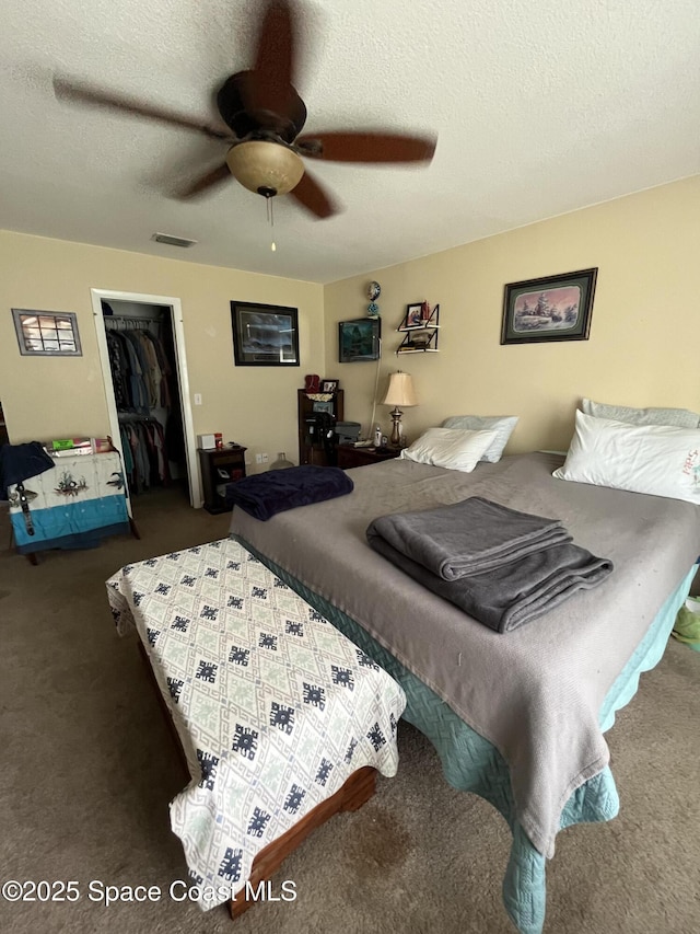 237 Jacaranda Ave NW, Palm Bay, FL 32907 - carpeted bedroom with a closet, a textured ceiling, and ceiling fan