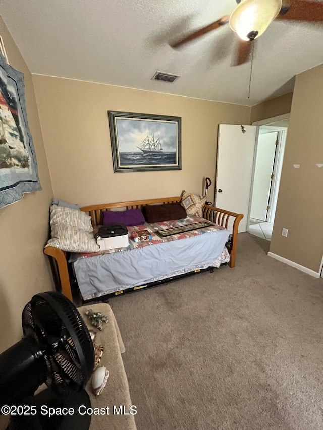 237 Jacaranda Ave NW, Palm Bay, FL 32907 - bedroom with carpet floors, ceiling fan, and a textured ceiling