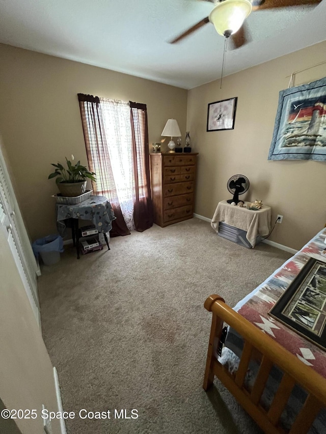 237 Jacaranda Ave NW, Palm Bay, FL 32907 - carpeted bedroom with a ceiling fan