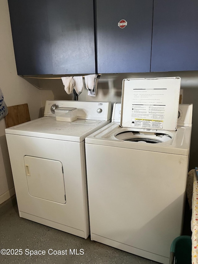 237 Jacaranda Ave NW, Palm Bay, FL 32907 - laundry room featuring washer and dryer and cabinet space