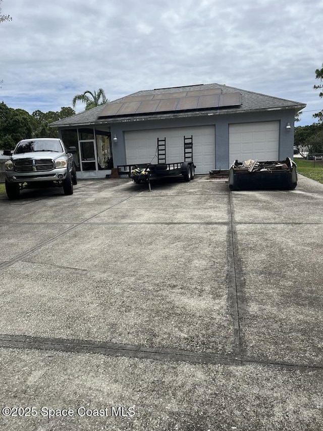237 Jacaranda Ave NW, Palm Bay, FL 32907 - view of home's exterior featuring a garage and solar panels
