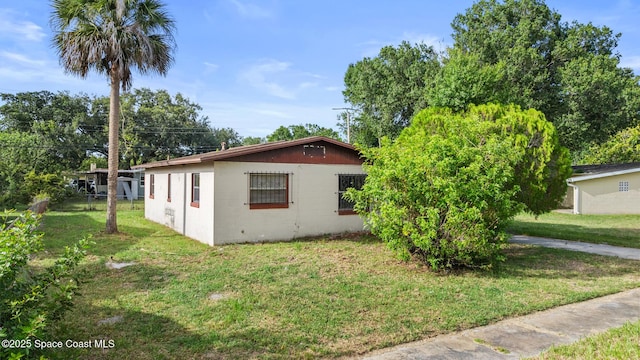 3774 Brockington Cir, Cocoa, FL 32926 - view of side of home featuring concrete block siding