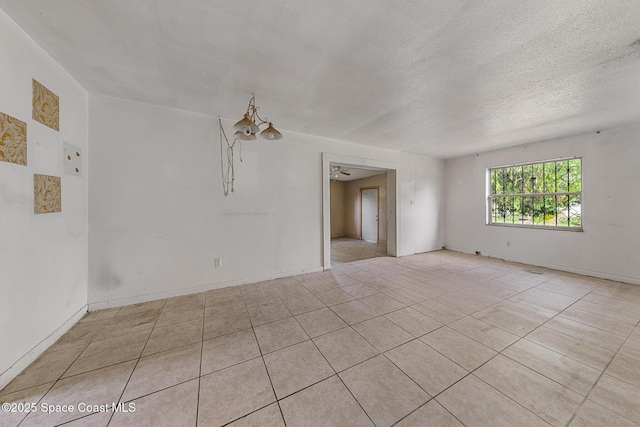 3774 Brockington Cir, Cocoa, FL 32926 - tiled empty room featuring a textured ceiling