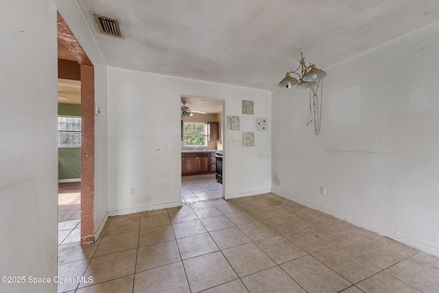 3774 Brockington Cir, Cocoa, FL 32926 - spare room featuring light tile patterned floors and ceiling fan