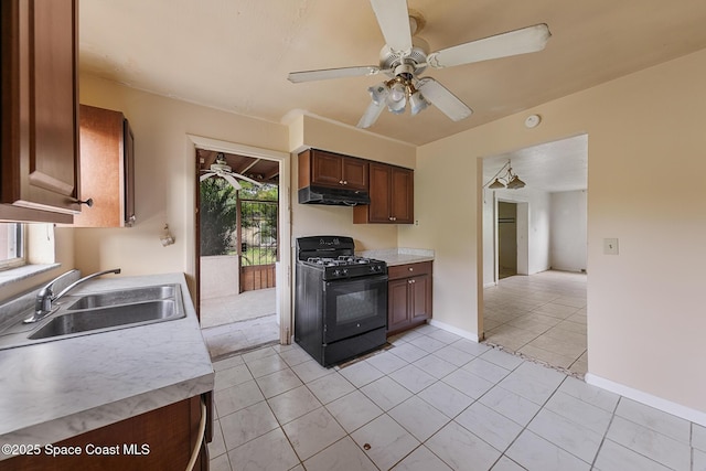 3774 Brockington Cir, Cocoa, FL 32926 - kitchen featuring black gas range oven, under cabinet range hood, ceiling fan, and light countertops