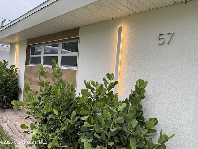 57 Riverview Ln, Cocoa Beach, FL 32931 - view of home's exterior featuring stucco siding