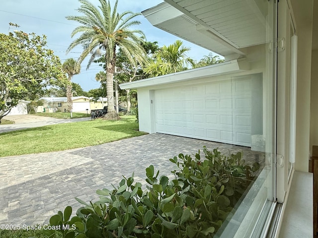 57 Riverview Ln, Cocoa Beach, FL 32931 - garage with decorative driveway
