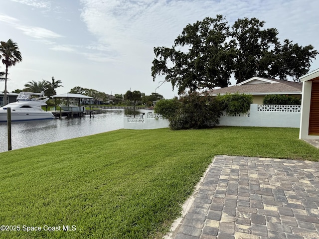 57 Riverview Ln, Cocoa Beach, FL 32931 - view of green lawn featuring a water view