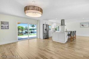 57 Riverview Ln, Cocoa Beach, FL 32931 - living area with light wood finished floors