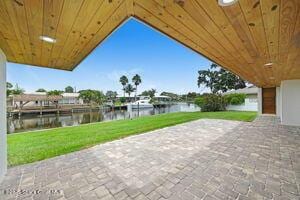 57 Riverview Ln, Cocoa Beach, FL 32931 - view of patio with a water view