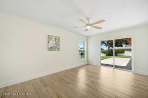57 Riverview Ln, Cocoa Beach, FL 32931 - unfurnished room with wood finished floors and a ceiling fan