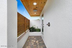 57 Riverview Ln, Cocoa Beach, FL 32931 - view of home's exterior with stucco siding