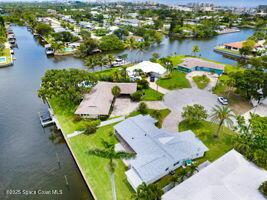 57 Riverview Ln, Cocoa Beach, FL 32931 - aerial view of residential area with a nearby body of water