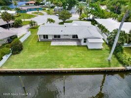 57 Riverview Ln, Cocoa Beach, FL 32931 - view of subject property featuring a nearby body of water