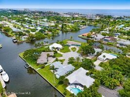 57 Riverview Ln, Cocoa Beach, FL 32931 - aerial view of property's location featuring a large body of water and nearby suburban area