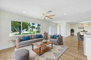 57 Riverview Ln, Cocoa Beach, FL 32931 - living area with ceiling fan, wood finished floors, and recessed lighting