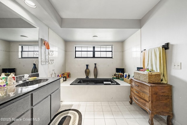2180 Figtree Dr Unit 0, Titusville, FL 32780 - bathroom with a garden tub, vanity, tile patterned flooring, and plenty of natural light