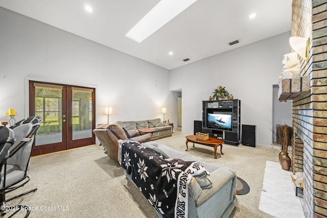 2180 Figtree Dr Unit 0, Titusville, FL 32780 - living area featuring carpet flooring, french doors, a brick fireplace, recessed lighting, and a towering ceiling