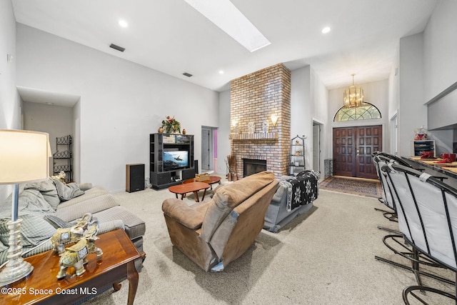 2180 Figtree Dr Unit 0, Titusville, FL 32780 - carpeted living area with high vaulted ceiling, a chandelier, a skylight, a fireplace, and recessed lighting