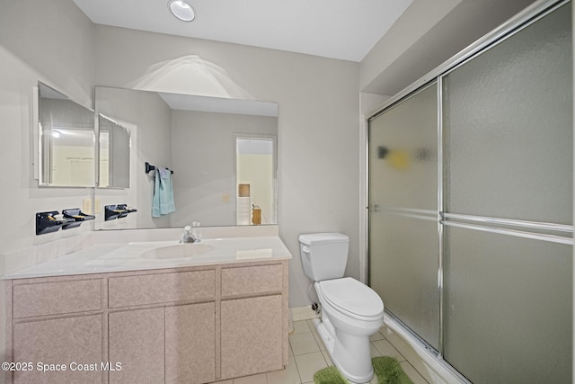 2180 Figtree Dr Unit 0, Titusville, FL 32780 - bathroom with a shower with door, tile patterned floors, and vanity