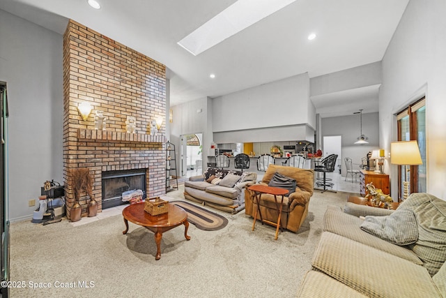 2180 Figtree Dr Unit 0, Titusville, FL 32780 - living area with recessed lighting, a brick fireplace, a skylight, and carpet floors