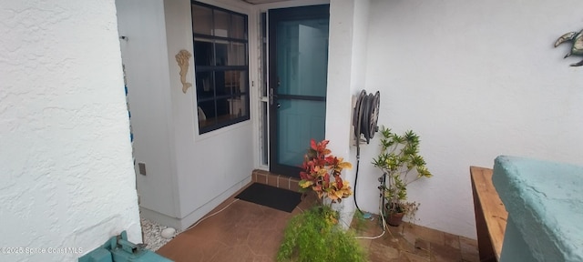290 Paradise Blvd # 84, Indialantic, FL 32903 - doorway to property with stucco siding