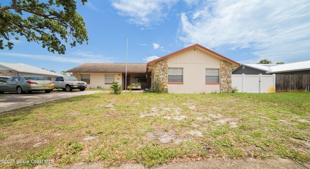 880 Williamsburg Dr, Titusville, FL 32780 - ranch-style house with stone siding
