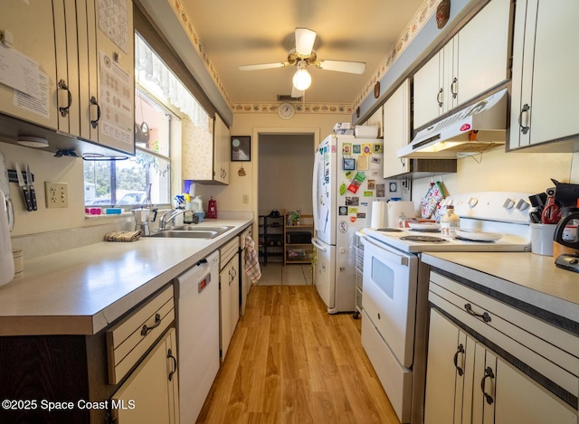 880 Williamsburg Dr, Titusville, FL 32780 - kitchen with white appliances, under cabinet range hood, a sink, light countertops, and ceiling fan