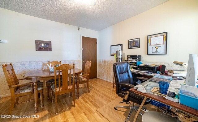 880 Williamsburg Dr, Titusville, FL 32780 - office area featuring wood finished floors and a textured ceiling