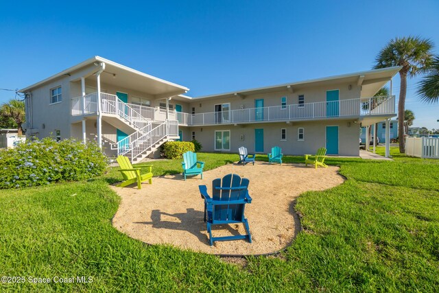 7515 Ridgewood Ave Unit 17A, Cape Canaveral, FL 32920 - view of community with a yard, stairs, and a patio area
