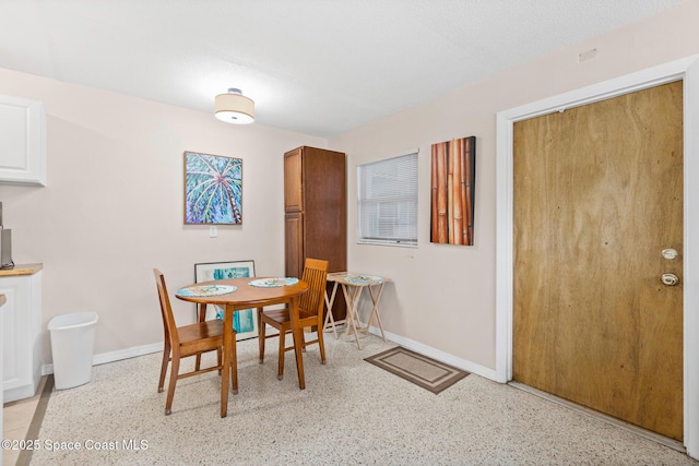 7515 Ridgewood Ave Unit 17A, Cape Canaveral, FL 32920 - dining area with baseboards