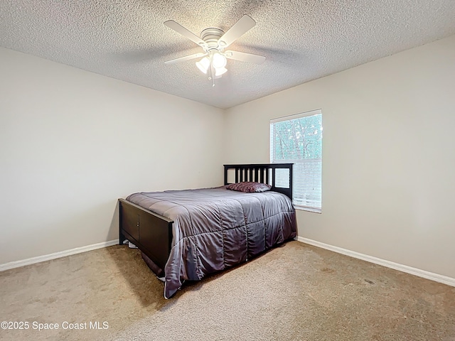 9525 Southern Garden Cir, Altamonte Springs, FL 32714 - carpeted bedroom featuring baseboards, a textured ceiling, and ceiling fan