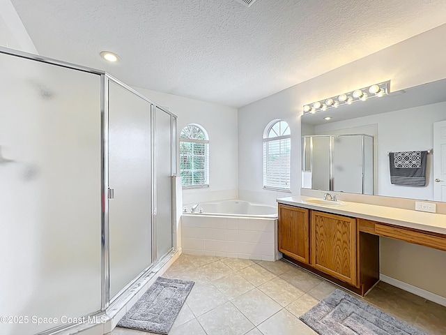 9525 Southern Garden Cir, Altamonte Springs, FL 32714 - bathroom with a shower stall, vanity, a bath, tile patterned floors, and a textured ceiling