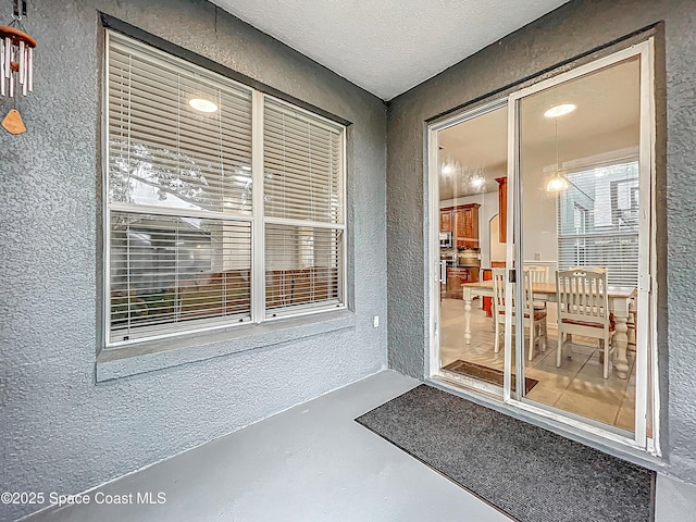 9525 Southern Garden Cir, Altamonte Springs, FL 32714 - property entrance with stucco siding