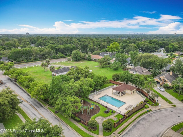 9525 Southern Garden Cir, Altamonte Springs, FL 32714 - drone / aerial view of a pool area and a heavily wooded area