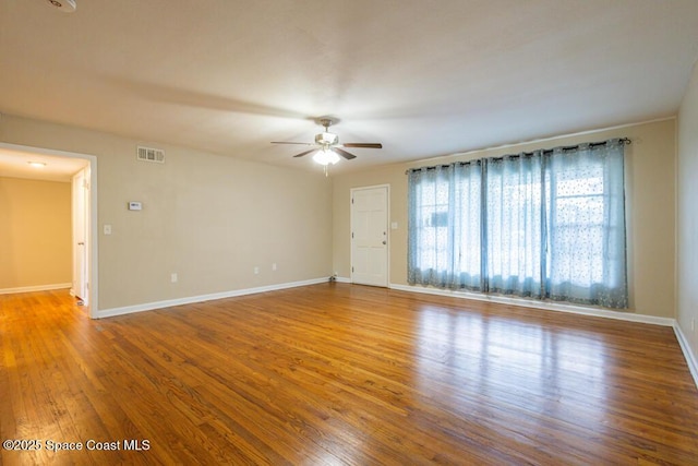 1108 Abington St, Cocoa, FL 32922 - unfurnished room featuring ceiling fan, wood finished floors, and baseboards