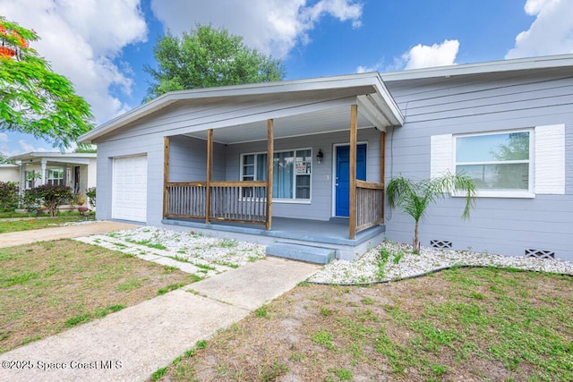 1108 Abington St, Cocoa, FL 32922 - ranch-style home featuring covered porch, a garage, and concrete driveway