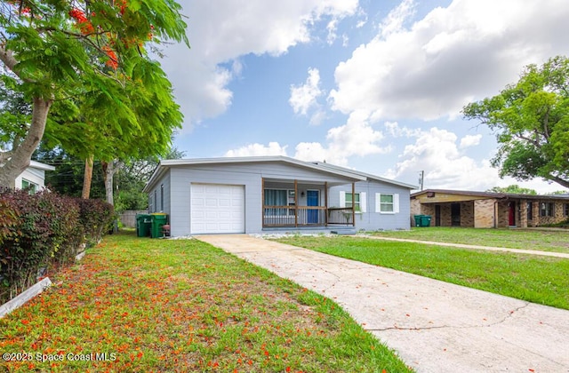 1108 Abington St, Cocoa, FL 32922 - view of front of property with a garage, driveway, a front yard, and covered porch