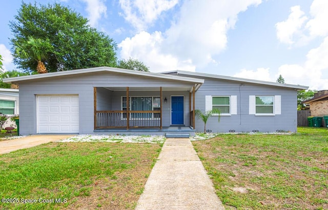 1108 Abington St, Cocoa, FL 32922 - view of front of home featuring a porch, a front yard, a garage, and driveway