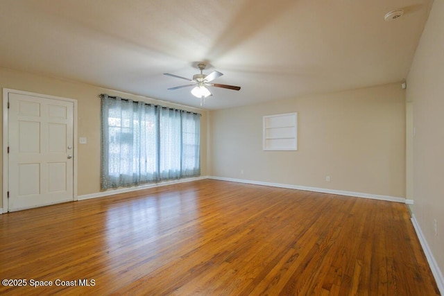 1108 Abington St, Cocoa, FL 32922 - empty room featuring ceiling fan, wood finished floors, baseboards, and a smoke detector