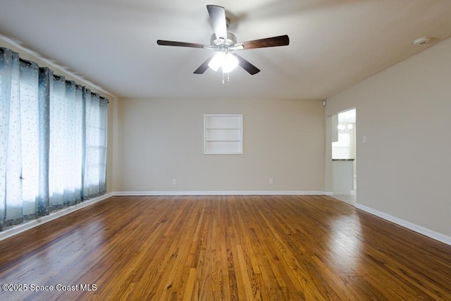 1108 Abington St, Cocoa, FL 32922 - empty room with a ceiling fan, baseboards, and wood finished floors