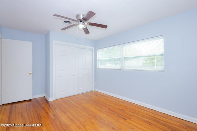 1108 Abington St, Cocoa, FL 32922 - unfurnished bedroom featuring baseboards, a closet, light wood-style floors, and ceiling fan