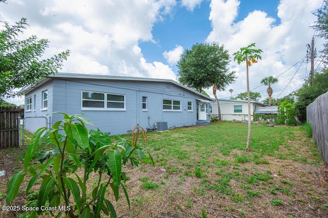 1108 Abington St, Cocoa, FL 32922 - back of house featuring central AC unit
